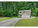 Traditional two-story home with a two-car garage and an expansive front lawn at 1925 Sailcloth St, Lithonia, GA 30058