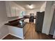 Bright kitchen with stainless steel appliances and dark counter tops at 1925 Sailcloth St, Lithonia, GA 30058