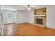 Spacious living room with hardwood floors and stone fireplace at 1925 Sailcloth St, Lithonia, GA 30058