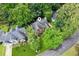 Overhead view of the house with the surrounding foliage and nearby street at 2220 Cape Courage Way, Suwanee, GA 30024
