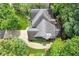 Overhead view of the house with the driveway and surrounding foliage at 2220 Cape Courage Way, Suwanee, GA 30024