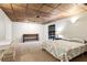 Finished basement with sleeping area featuring a queen bed, desk and storage, and soft lighting at 2220 Cape Courage Way, Suwanee, GA 30024
