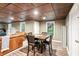 Finished basement with a dining table and chairs, a comfortable seating area, and natural light at 2220 Cape Courage Way, Suwanee, GA 30024