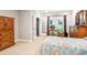 Bright bedroom with a desk area, natural light, and neutral tones at 2220 Cape Courage Way, Suwanee, GA 30024