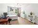 Bright bedroom with a ceiling fan, white furniture, and a window letting in natural light at 2220 Cape Courage Way, Suwanee, GA 30024