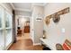 Inviting entryway features a decorative bench, hooks, and a view into the home at 2220 Cape Courage Way, Suwanee, GA 30024