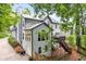 View of the house with a deck, stairwell, and driveway at 2220 Cape Courage Way, Suwanee, GA 30024