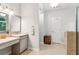 Elegant main bathroom featuring dual vanities, tile flooring, and access to a private shower at 2220 Cape Courage Way, Suwanee, GA 30024
