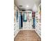 Spacious walk-in closet featuring custom storage solutions and ample space for clothing and accessories at 2220 Cape Courage Way, Suwanee, GA 30024