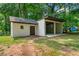 View of the home's backyard showing the storage shed and covered parking at 276 Lydia Se Dr, Atlanta, GA 30315
