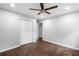 Bedroom featuring hardwood floors, a ceiling fan, and a double door closet at 276 Lydia Se Dr, Atlanta, GA 30315