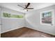Bright bedroom featuring hardwood floors, a ceiling fan, and light gray walls at 276 Lydia Se Dr, Atlanta, GA 30315