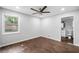 Bright bedroom with hardwood floors, a ceiling fan, and an attached bathroom at 276 Lydia Se Dr, Atlanta, GA 30315