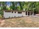 Charming single-story home with a white brick exterior and a well-manicured front yard at 276 Lydia Se Dr, Atlanta, GA 30315