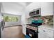 Spacious kitchen with stainless steel appliances, gas range, and window to the outside at 276 Lydia Se Dr, Atlanta, GA 30315