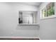 View of a kitchen through a wall opening, with hardwood floors, and bright, natural light at 276 Lydia Se Dr, Atlanta, GA 30315