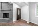 Entryway with hardwood floors, a decorative fireplace, and a view of the front door at 276 Lydia Se Dr, Atlanta, GA 30315