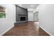 View of a living room with a gray brick fireplace, hardwood floors, and multiple windows at 276 Lydia Se Dr, Atlanta, GA 30315