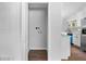 Walk-in pantry near the kitchen with hardwood floors and white walls at 276 Lydia Se Dr, Atlanta, GA 30315