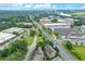Aerial view featuring a community of townhomes with a cityscape backdrop and lush landscaping and well-maintained grounds at 4853 Stonehall Pl, Atlanta, GA 30339
