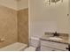 Bathroom featuring tiled shower/tub, granite vanity, and toilet at 4853 Stonehall Pl, Atlanta, GA 30339