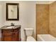 Bathroom with patterned tile, vanity with carved details, and a bathtub at 4853 Stonehall Pl, Atlanta, GA 30339