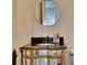 Stylish bathroom vanity with mirrored cabinet, granite countertop, and decorative fixtures at 4853 Stonehall Pl, Atlanta, GA 30339