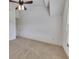 Carpeted bedroom with a ceiling fan and a large window at 4853 Stonehall Pl, Atlanta, GA 30339