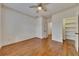 Bedroom with hardwood floors and a view of a walk-in closet with built-in shelves at 4853 Stonehall Pl, Atlanta, GA 30339