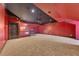 Bonus room with unique ceiling, carpet, wrought iron staircase, and decorative lighting at 4853 Stonehall Pl, Atlanta, GA 30339