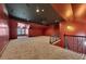 Spacious bonus room with carpeting, unique ceiling design, and staircase access at 4853 Stonehall Pl, Atlanta, GA 30339