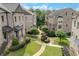Landscaped courtyard featuring walkways and mature trees at 4853 Stonehall Pl, Atlanta, GA 30339