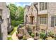Beautiful stone and brick home with manicured landscaping and a charming walkway at 4853 Stonehall Pl, Atlanta, GA 30339