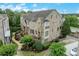 Aerial view of brick and stone home with well-maintained landscaping at 4853 Stonehall Pl, Atlanta, GA 30339