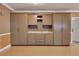 A spacious garage with custom cabinets and epoxy floors for organized storage and easy maintenance in a residential home at 4853 Stonehall Pl, Atlanta, GA 30339