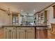 The kitchen island boasts granite countertops and stainless steel appliances at 4853 Stonehall Pl, Atlanta, GA 30339