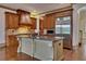 Gourmet kitchen featuring stainless steel appliances and a granite countertop island at 4853 Stonehall Pl, Atlanta, GA 30339