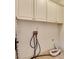 Laundry room with storage cabinets, laundry hookups, and tile flooring at 4853 Stonehall Pl, Atlanta, GA 30339