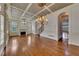 Elegant living room with hardwood floors, fireplace, and coffered ceilings at 4853 Stonehall Pl, Atlanta, GA 30339