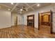 Living room features hardwood floors, fireplace, detailed ceiling, and access to wine storage at 4853 Stonehall Pl, Atlanta, GA 30339