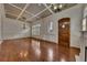 Spacious living room with hardwood floors, coffered ceiling, and ample natural light at 4853 Stonehall Pl, Atlanta, GA 30339