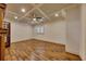 Living room with detailed ceiling, hardwood floors, window with shutters, and fireplace at 4853 Stonehall Pl, Atlanta, GA 30339