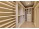 Spacious walk-in closet features custom shelving and storage solutions for optimal organization and a closet system at 4853 Stonehall Pl, Atlanta, GA 30339