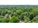 An aerial view of a home with a mature tree canopy in a neighborhood setting at 1026 Reeder N Cir, Atlanta, GA 30306