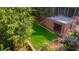 Overhead view of verdant backyard, brick architecture, and landscaped garden area at 1026 Reeder N Cir, Atlanta, GA 30306