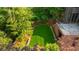 Bird's eye view of green backyard, brick building, and patio at 1026 Reeder N Cir, Atlanta, GA 30306