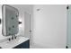 A bathroom featuring a marble countertop, black faucet and mirror, and a glass enclosed shower at 1026 Reeder N Cir, Atlanta, GA 30306