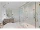 Luxurious bathroom featuring marble floors, a standalone tub, glass shower, and modern vanity at 1026 Reeder N Cir, Atlanta, GA 30306