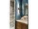 Stylish bathroom features a marble countertop, gold hardware, and a beautifully tiled walk-in shower at 1026 Reeder N Cir, Atlanta, GA 30306