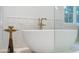 Close-up of a luxurious bathroom featuring a modern tub and elegant marble accents at 1026 Reeder N Cir, Atlanta, GA 30306